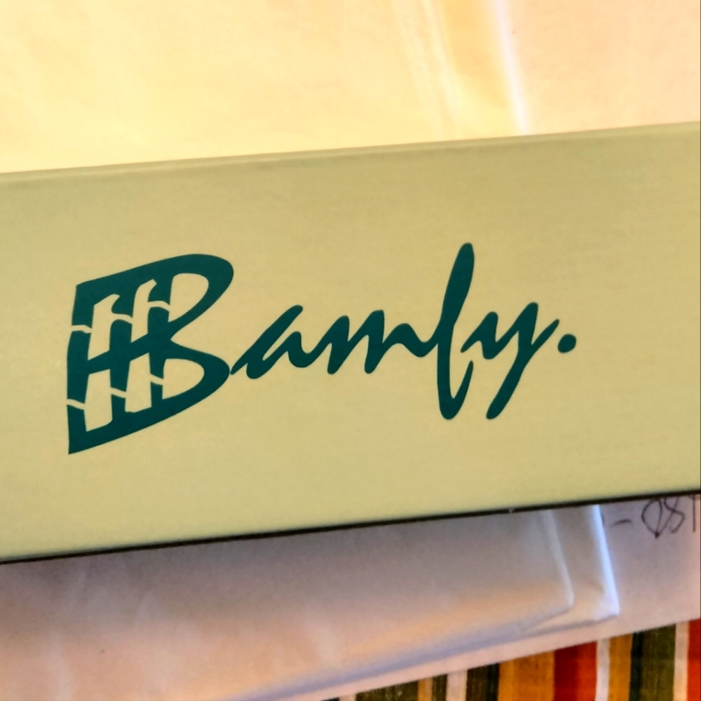 Sunglasses by Bamfy. Black with bamboo legs in case.